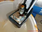 Druckleitung reinigen - Kreuzschlitzschrauben lösen